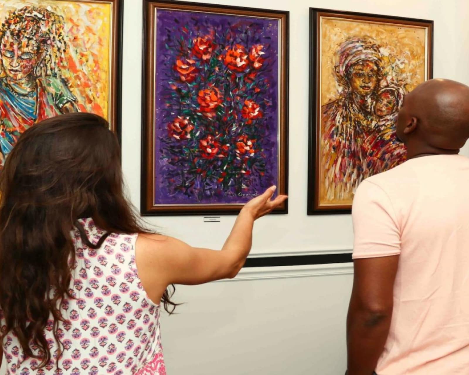 Contemporary African art exhibition showcasing vibrant African paintings and sculptures at Ovico Gallery.