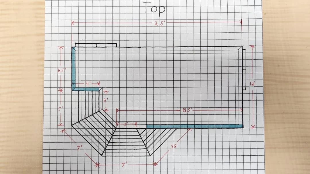 Graph paper with a detailed deck design showing dimensions, step plans, and handrail details from a top view.