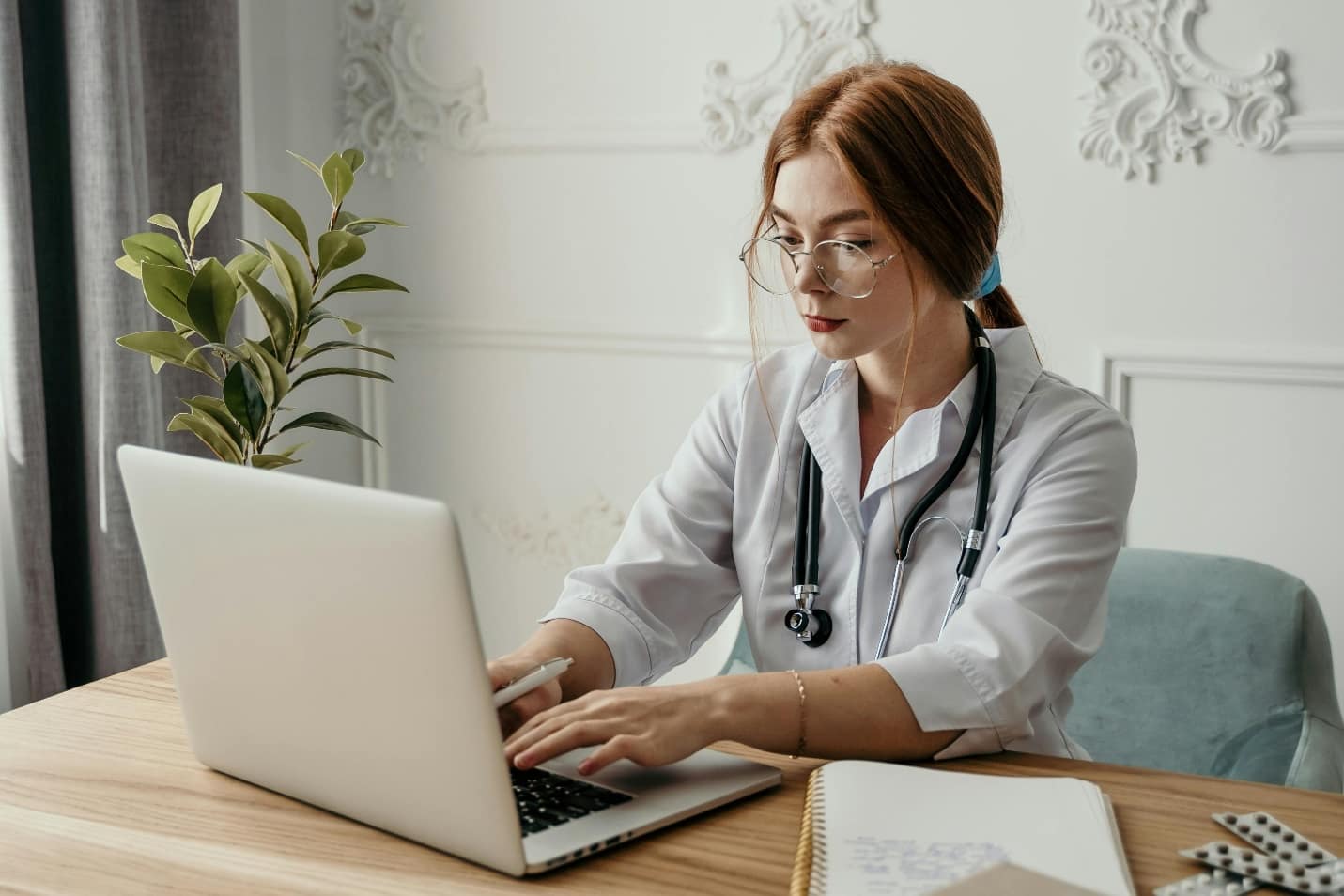 Doctor using a laptop