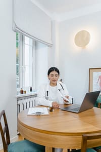 A doctor conducting a virtual consultation with a patient.