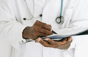 A doctor writing a prescription.