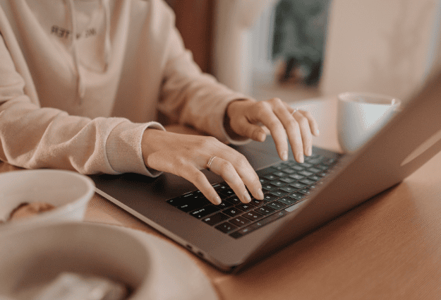 woman typing on laptop