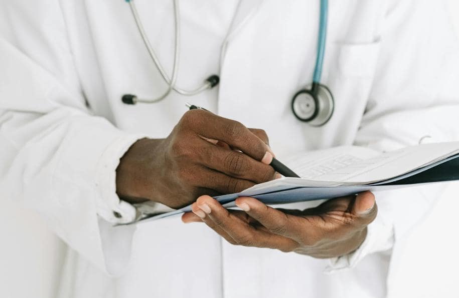 A doctor writing a prescription.