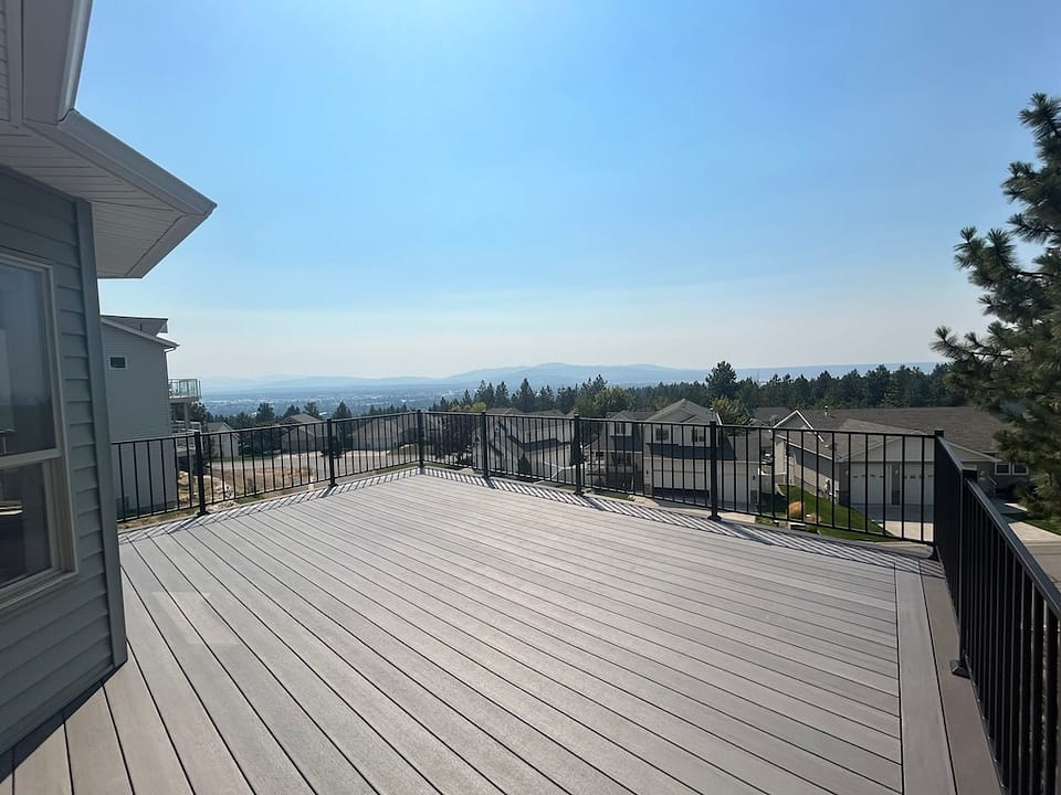 Beautiful deck overlooking the suburbs with distant mountain views.