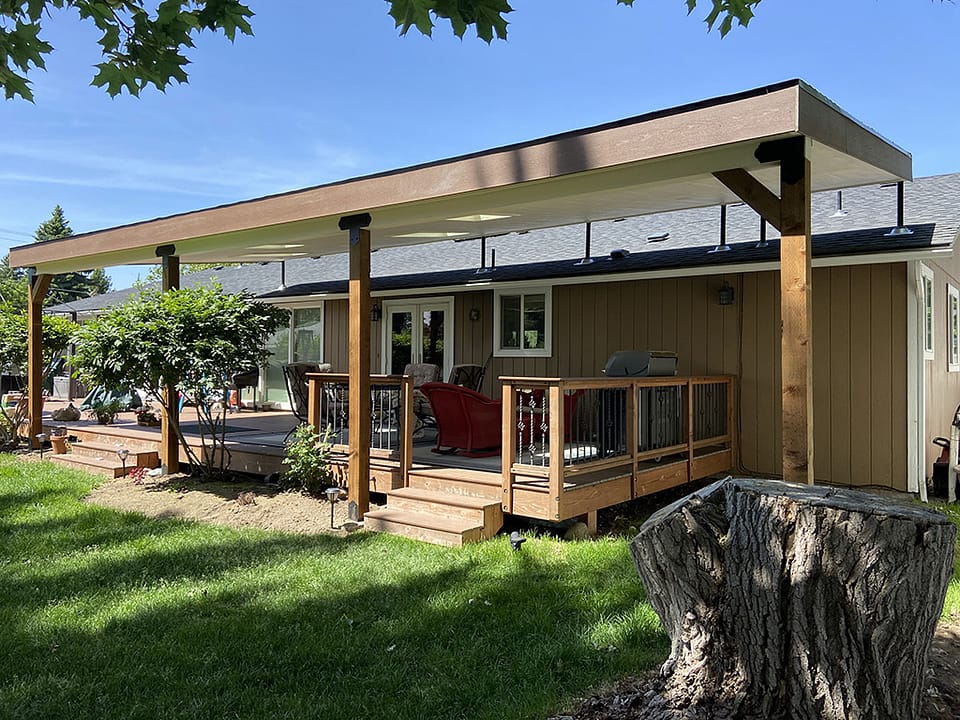 Lean-to roof covers a back deck.