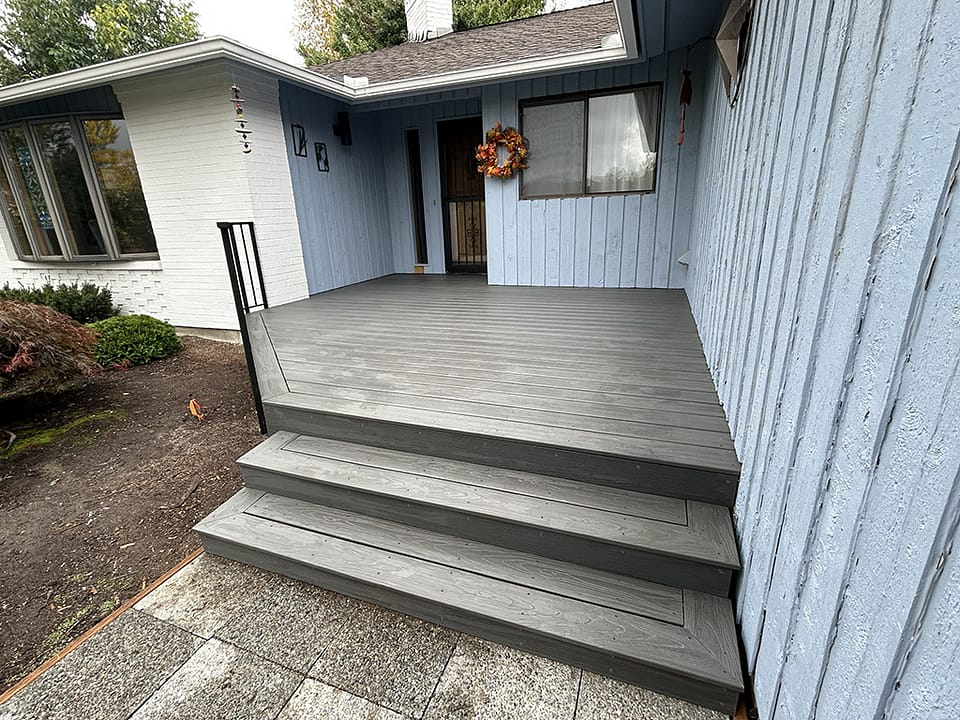 Front porch finished in a dark grey color.