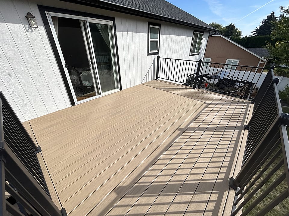 New back deck seamlessly connected to a modern home.