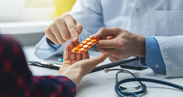 Doctor Handing Pills Patient image