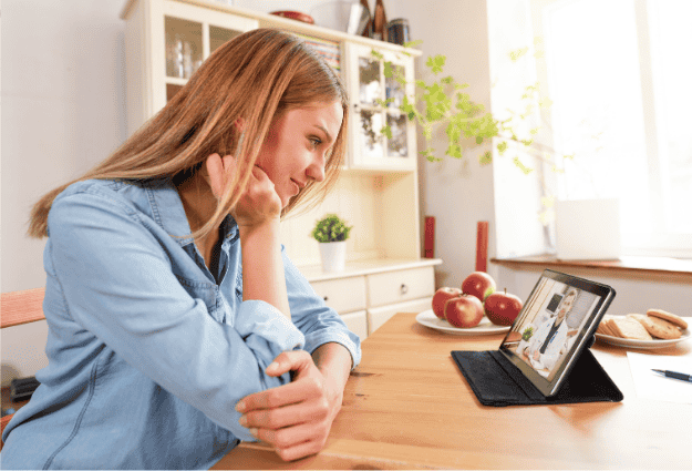 woman talking to doctor over tablet video call