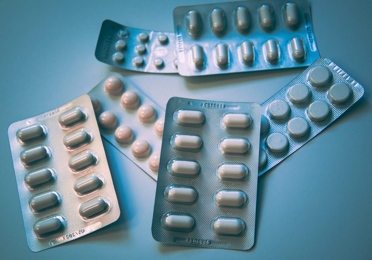 Various antifungal medications and treatments placed on a counter for managing yeast infections
