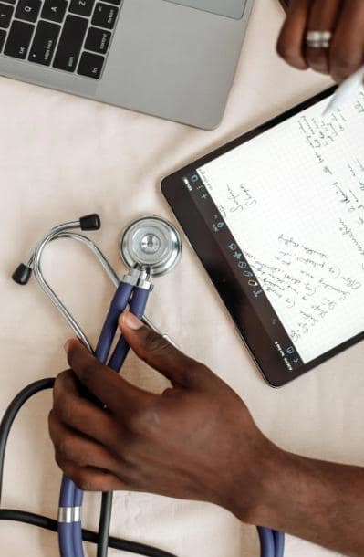 A doctor writing an online prescription.