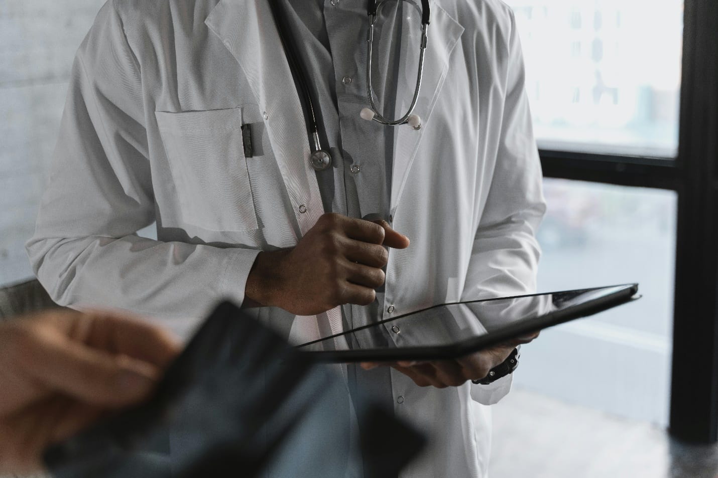 Doctor using a tab