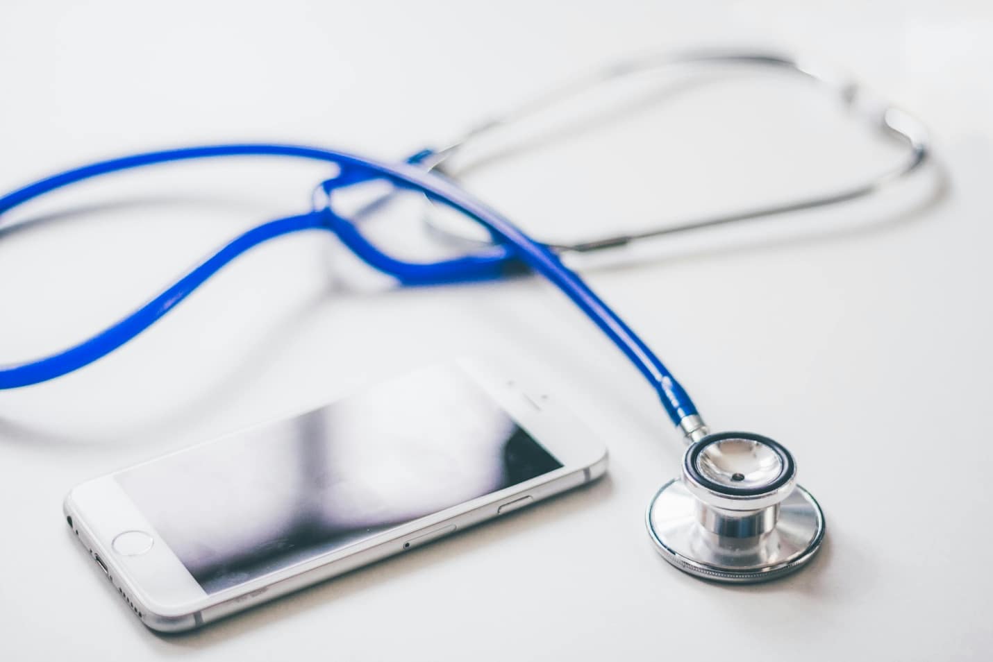 Stethoscope next to a mobile phone